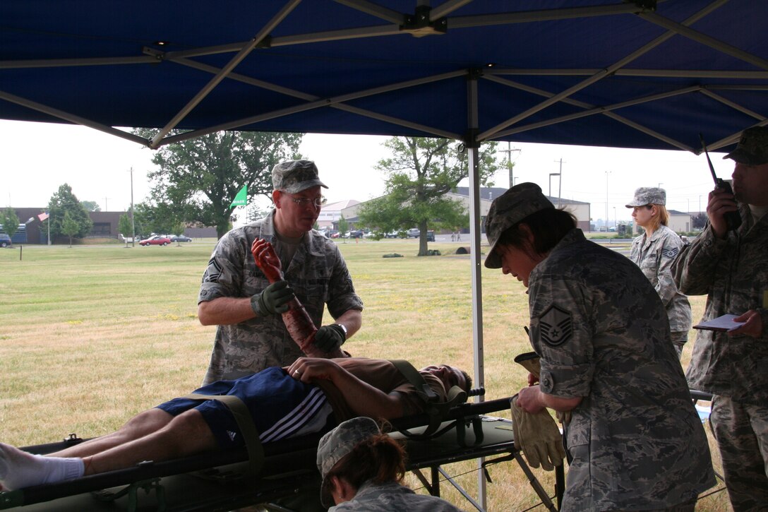 914th Aeromedical Staging Squadron Airmen participate in a mass casualty exercise during the July Unit Training Assembly at the Niagara Falls Air Reserve Station, N.Y.  July 25.To ensure readiness for the upcoming 2011 Thunder of Niagara Air Show, the exercise consisted of medical teams responding to multiple scenarios that could happen at any public event on base.  (U.S. Air Force courtesy photo by Tech Sgt. Jaimelynn Winkler)