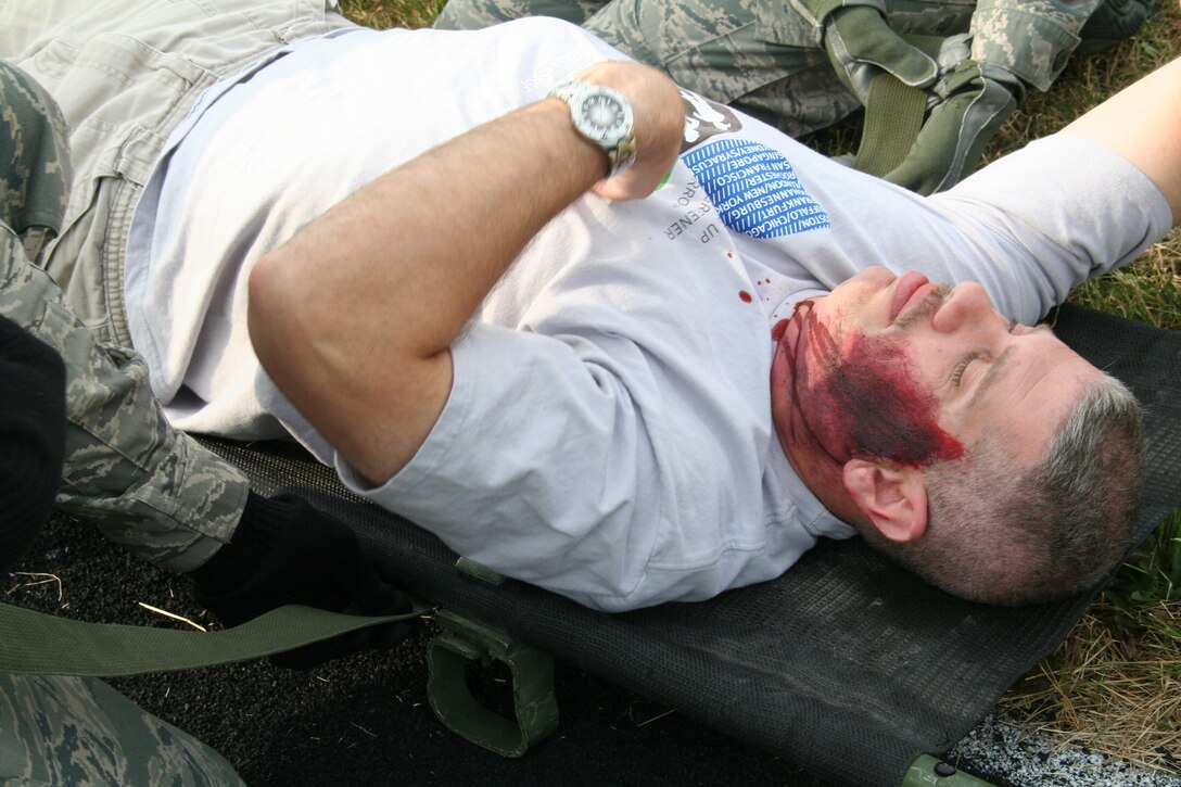 914th Aeromedical Staging Squadron Airmen participate in a mass casualty exercise during the July Unit Training Assembly at the Niagara Falls Air Reserve Station, N.Y.  July 25.To ensure readiness for the upcoming 2011 Thunder of Niagara Air Show, the exercise consisted of medical teams responding to multiple scenarios that could happen at any public event on base.  (U.S. Air Force courtesy photo by Tech Sgt. Jaimelynn Winkler)