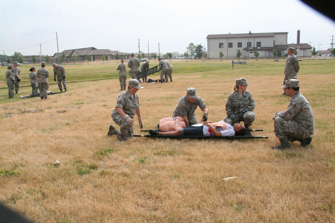 914th Aeromedical Staging Squadron Airmen participate in a mass casualty exercise during the July Unit Training Assembly at the Niagara Falls Air Reserve Station, N.Y.  July 25.To ensure readiness for the upcoming 2011 Thunder of Niagara Air Show, the exercise consisted of medical teams responding to multiple scenarios that could happen at any public event on base.  (U.S. Air Force courtesy photo by Tech Sgt. Jaimelynn Winkler)
