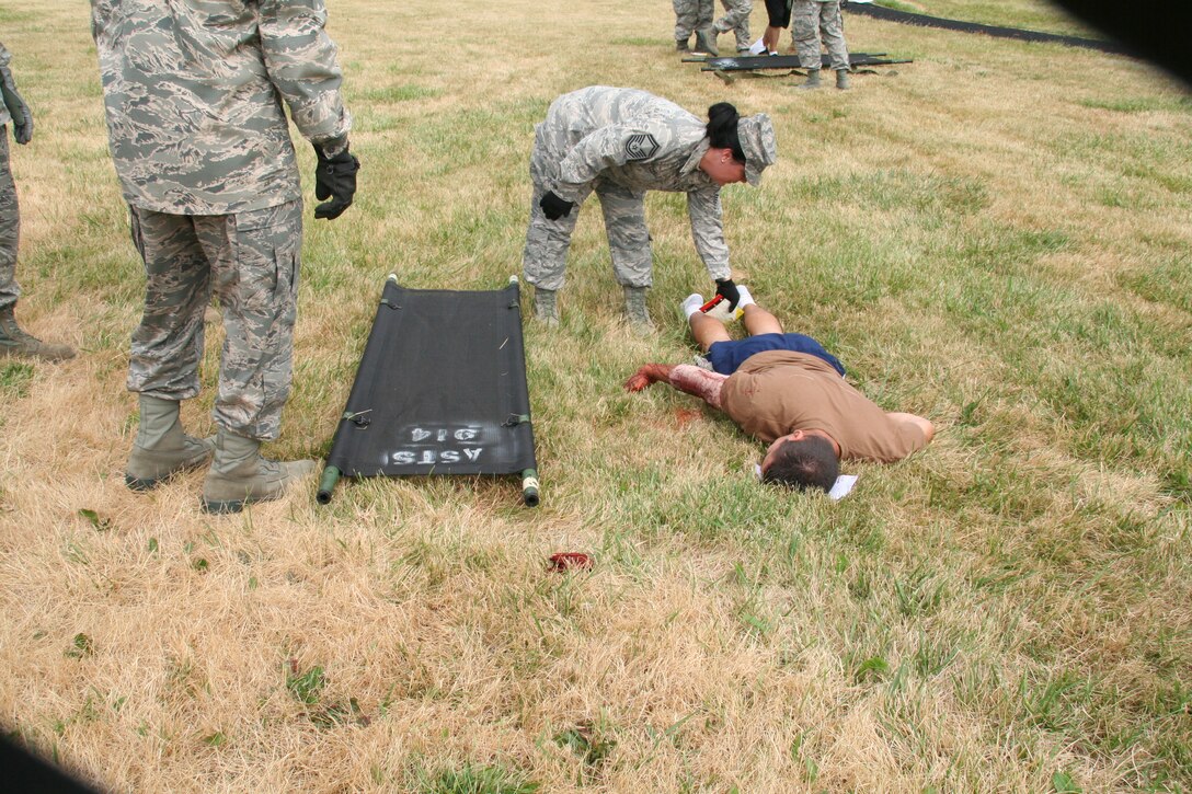 914th Aeromedical Staging Squadron Airmen participate in a mass casualty exercise during the July Unit Training Assembly at the Niagara Falls Air Reserve Station, N.Y.  July 25.To ensure readiness for the upcoming 2011 Thunder of Niagara Air Show, the exercise consisted of medical teams responding to multiple scenarios that could happen at any public event on base.  (U.S. Air Force courtesy photo by Tech Sgt. Jaimelynn Winkler)