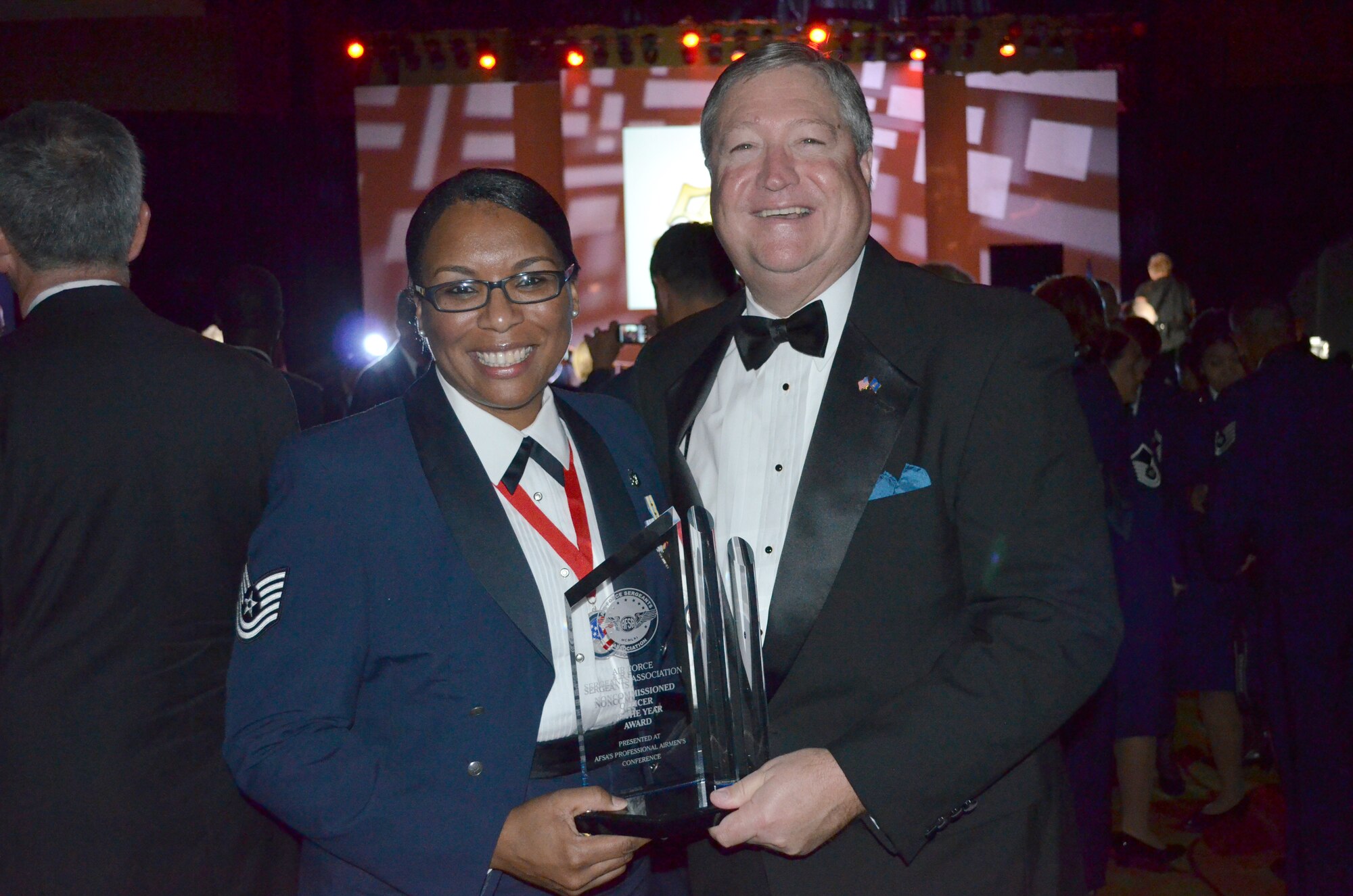 SEYMOUR JOHNSON AIR FORCE BASE, N.C. -- Recently-promoted Master Sgt. Nina Anderson poses with Secretary of the Air Force Michael Donley after being named the Air Force Sergeant’s Association International NCO of the Year at the Professional Airmen’s Conference gala July 27, 2011, in San Antonio. (Courtesy photo)