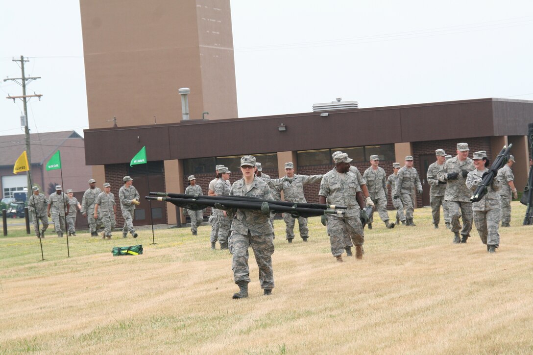 914th Aeromedical Staging Squadron Airmen participate in a mass casualty exercise during the July Unit Training Assembly at the Niagara Falls Air Reserve Station, N.Y.  July 25.To ensure readiness for the upcoming 2011 Thunder of Niagara Air Show, the exercise consisted of medical teams responding to multiple scenarios that could happen at any public event on base.  (U.S. Air Force courtesy photo by Tech Sgt. Jaimelynn Winkler)