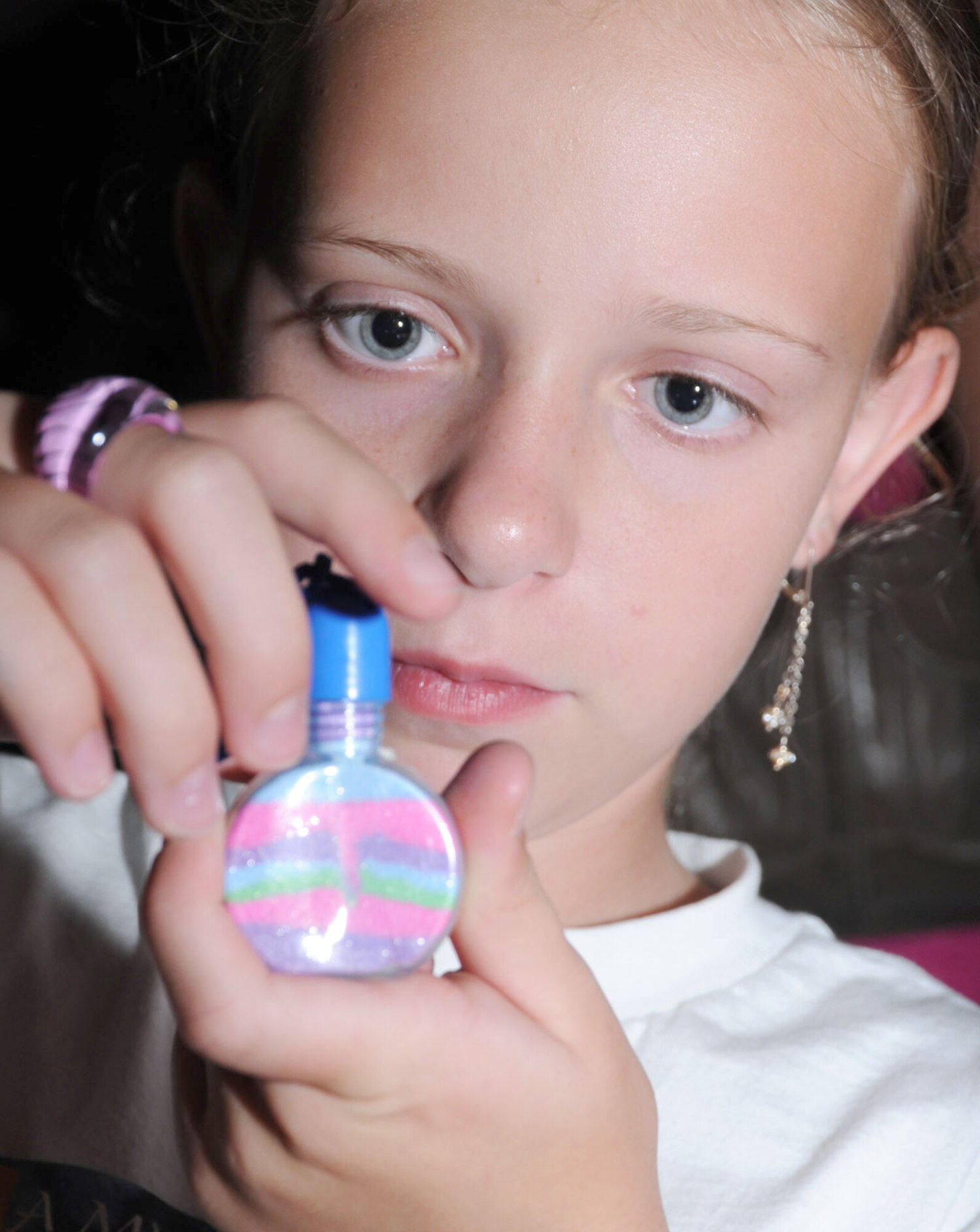 Charity Hurst, 10, encapsulates her sand art in a bottle during the Medieval Faire, the
finale to the A Midsummer Knight’s Read summer reading program at McBride Library. The Medieval Faire was held at the Vandenburg Community Center July 28. Charity is the daughter of Staff Sgt. Travis and Kristy Hurst, 345th Airlift Squadron.  (U.S. Air Force photo by Kemberly Groue)