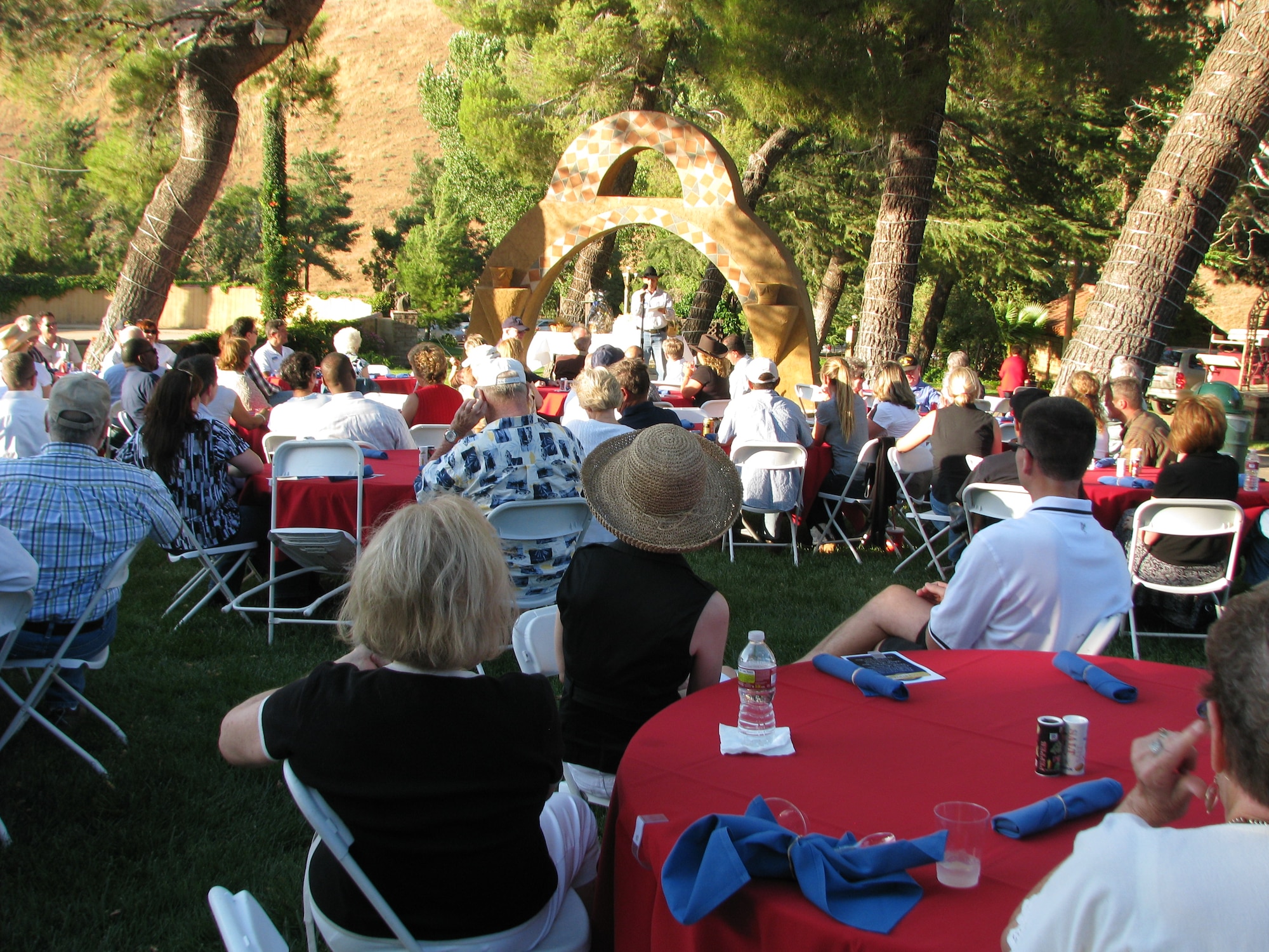 Guests attending the 20th annual Civ-Mil barbeque in Palmdale, Calif., July 28 enjoyed relaxing in the shade while visiting old friends and making new ones. The common goal for the evening was to raise funds for Edwards Civilian-Military Support Group for their annual project to help Edwards Airmen. (Air Force photo by Diane Betzler)