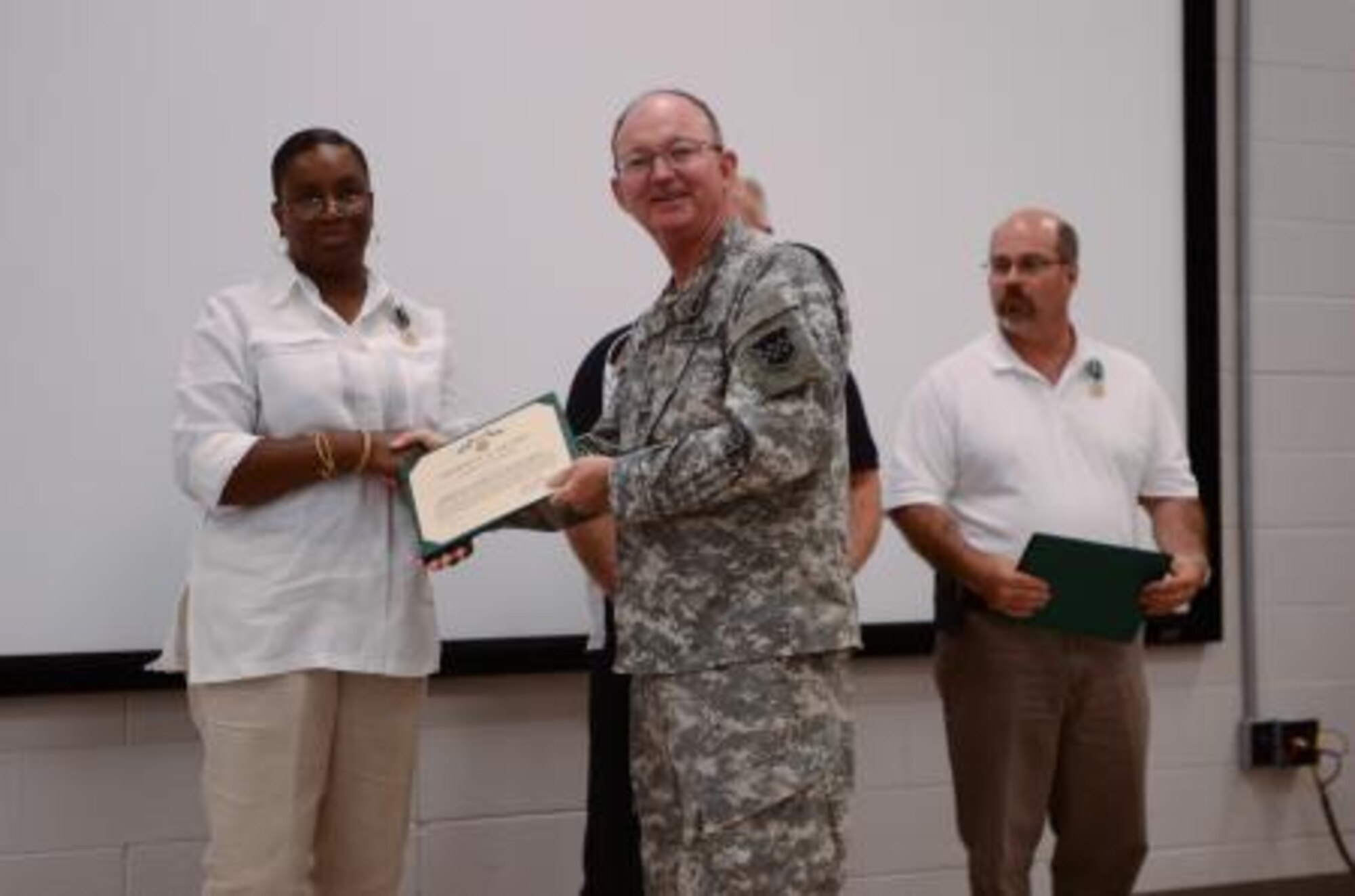 Maj. Gen. William D. Razz Waff, commanding general of the 99th Regional Support Command, presents Dedryann Dorner with the Commander’s Award for Civilian Service at Joint Base McGuire-Dix-Lakehurst July 28. Dorner worked with the Director of Logistics to standardize the position descriptions for all four regional support commands while flawlessly creating and tracking Requests for Civilian Personnel Actions. (Courtesy photo/Released)