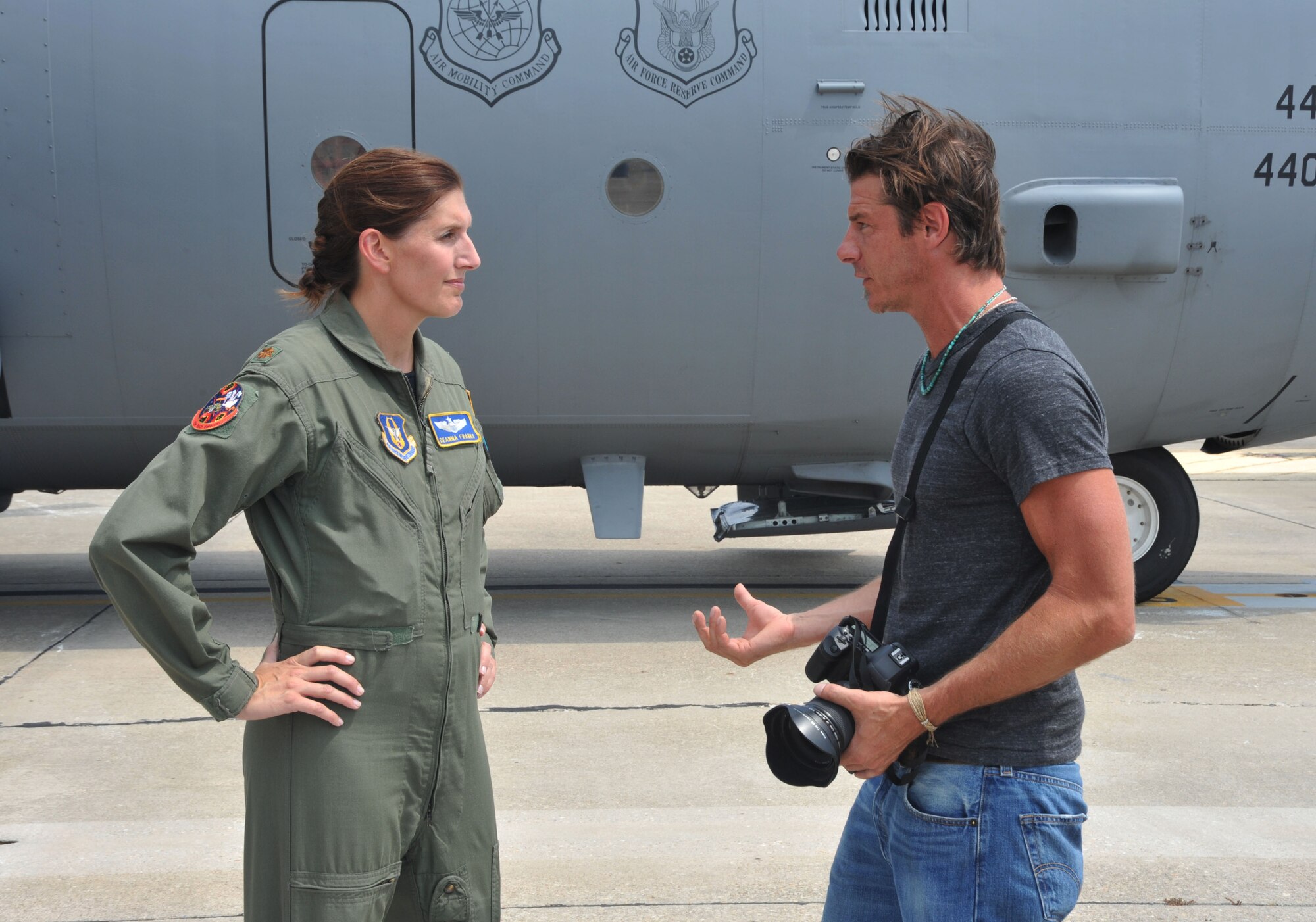 During the July 19, 2011 filming for an upcoming Extreme Makeover Home Edition production, Major DeAnna Franks, 95th Airlift Squadron pilot, discusses the capablities of the C-130 aircraft with Ty Pennington, host of the popular TV show.  (U.S. Air Force photo by Senior Master Sgt. Kevin Brody)