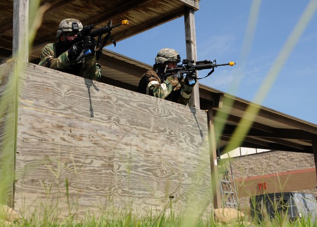 Security Forces members from the 628th Security Forces Squadron secure their perimeter of responsibility during the Operational Readiness Exercise at Gulfport Training Center, Miss. July 31. Airmen from Joint Base Charleston simulated a deployment to the Korean peninsula as part of a humanitarian relief effort. (U.S. Air Force photo/Staff Sgt. Katie Gieratz)(RELEASED)