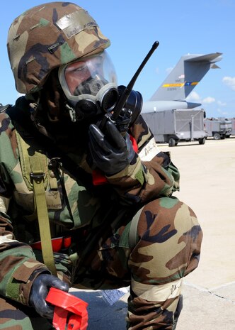 Staff Sgt. Leslie Monetenegro radios in her progress during her sweep of the flightline during the Operational Readiness Exercise held at Gulfport Training Center, Miss. July 31. Montenegro was assigned as a member of the post-attack reconnaissance team for the deployed Medical Group during the exercise. Montenegro is a member of the 628th Medical Group at Joint Base Charleston, S.C.. (U.S. Air Force photo/Staff Sgt. Katie Gieratz)
