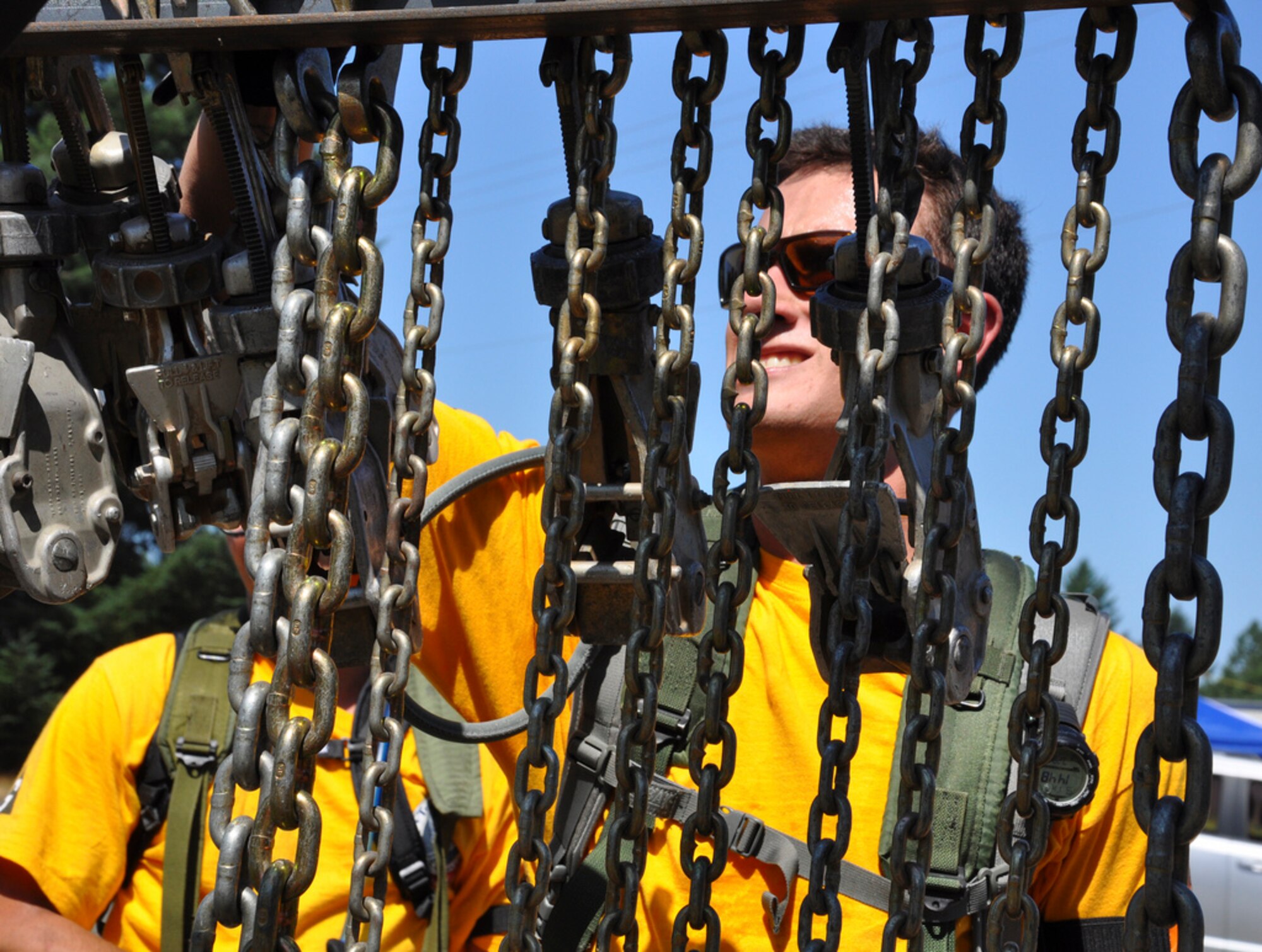 Senior Airman Emmette Bush, 305th Aerial Port Squadron, tackles one of the obstacles during the Rodeo 2011 Aerial Port Challenge Course. He and his teammates ran 3.6 miles and complete 14 obstacles, challenging their physical ability and teamwork. (U.S. Air Force photo by 1st Lt. Carolyn Glover/Released)  