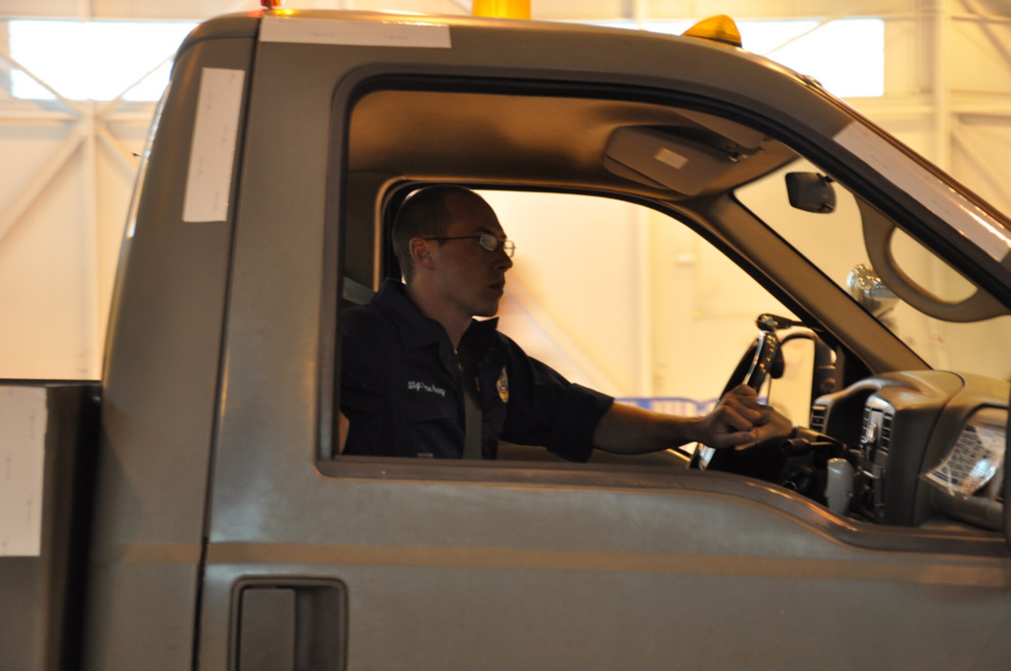 Staff Sgt. Chase Penny, Team McGuire C-17 Maintenance team member,  shows off his driving skills during the Maintenance Skills competition at Rodeo this year. Maintainers performed various tasks through a 30 minute period, demonstrating their skills and efficiency. (U.S. Air Force photo by 1st Lt. Carolyn Glover/Released)
