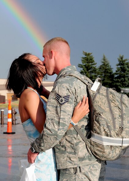 Staff Sgt. Christopher Byrnes shares a long-awaited kiss with his girlfriend, Racheal Maki, at Ellsworth Air Force Base, S.D., upon his return from deployment July 27, 2011. The homecoming celebration saw several hundred friends and family members present to welcome home their loved ones. (U.S. Air Force photo/Airman Alystria Mauer/Released)