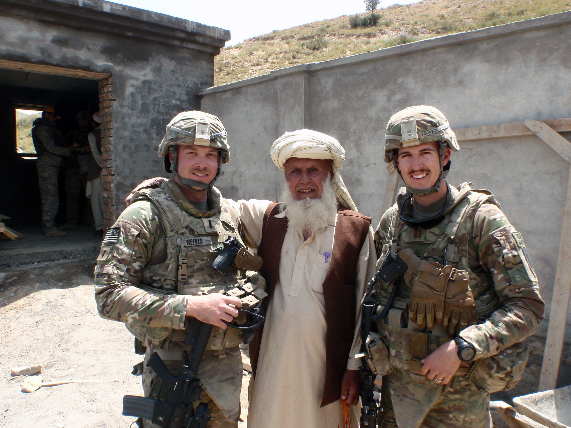U.S. Air Force 1st Lt. Cale Reeves, Provincial Reconstruction Team Paktya civil engineer deployed from Moody Air Force Base, Ga., left, and Capt. Tyler Johnson, another PRT Paktya civil engineer, stand with an Afghan leader following a quality control assessment in Paktya Province. Reeves and Johnson are deployed to PRT Paktya, as part of a team of more than 75 Service members who work in cooperation with the government of Afghanistan to facilitate the development of the province. (Courtesy photo/Released)
