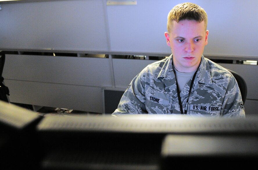 Airman 1st Class Christopher Stone, Air Forces Central network operations security center operations floor enterprise technician, works on a communication issue on his computer Aug. 3, 2011 at Shaw Air Force Base, S.C. He performs shift work at the NOSC to maintain AFCENT deployed site communications. He is the Warrior of the Week for the week of August 1 through 5. (U.S. Air Force photo/ Airman 1st Class Daniel Phelps)(Released) 