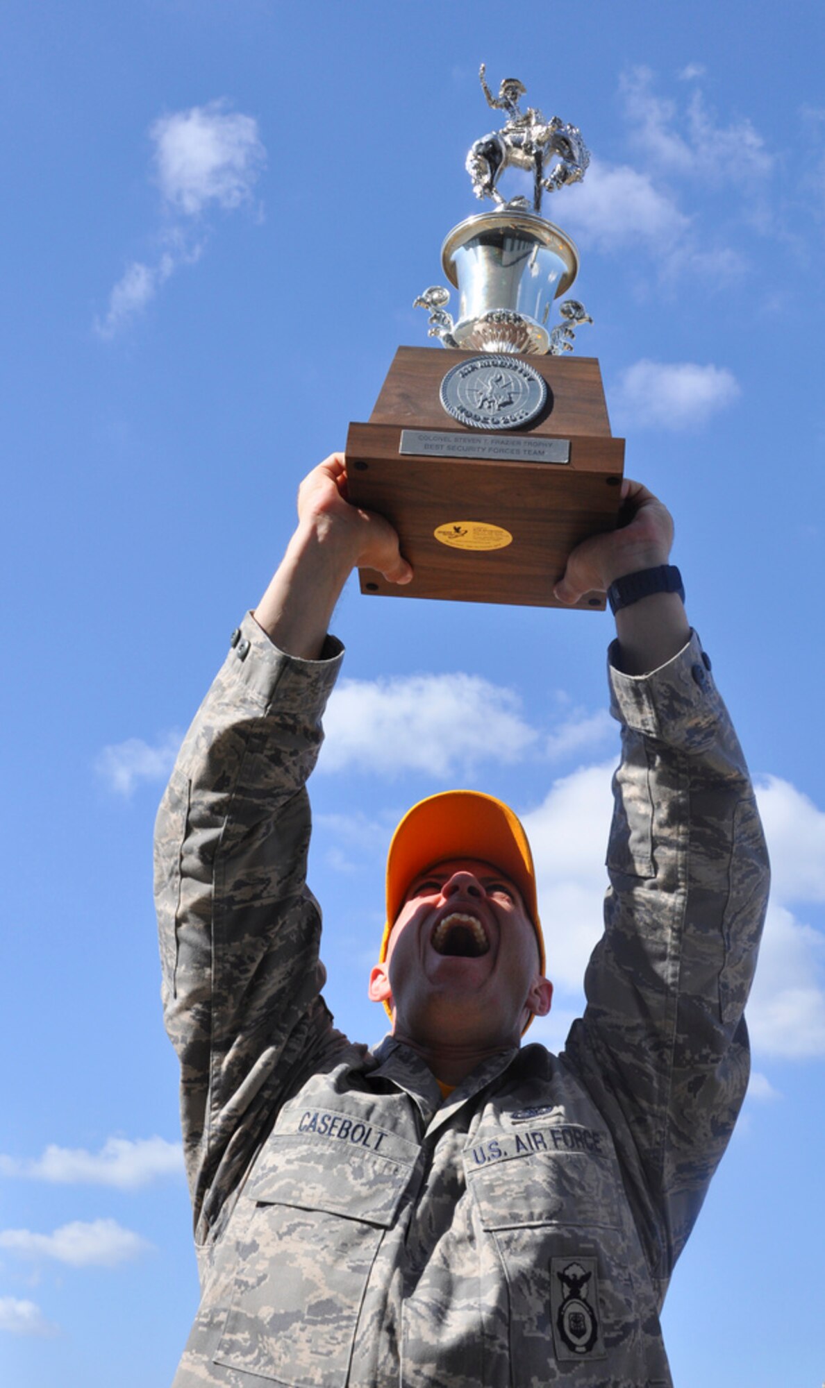 Staff Sgt. Trevor Casebolt, 87th Security Forces Squadron, celebrates the team's victory after the Air Mobility Rodeo 2011 Awards Ceremony at Joint Base Lewis-McChord, Wash. Team McGuire's SFS team was named the best of 28  SF teams at Rodeo this year. Other team members were: Master Sgt. Chris Wright, team chief, Tech. Sgt. James Chubb, Senior Airman Dana Corriveau and Airman 1st Class Morgan Buckley. (U.S. Air Force photo by 1st Lt. Carolyn Glover/Released)  