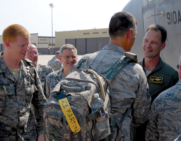 Col. Eric Overturf, 442nd Fighter Wing cvommander, sees off approximately 35 reservists from the wing's civil engineers squadron, July 30 as they head to Texas for combat skills training prior to deployment. The 442nd Fighter Wing is an A-10 Thunderbolt II Air Force Reserve unit at Whiteman Air Force Base, Mo. (U.S. Air Force photo/Tech. Sgt. Kent Kagarise)