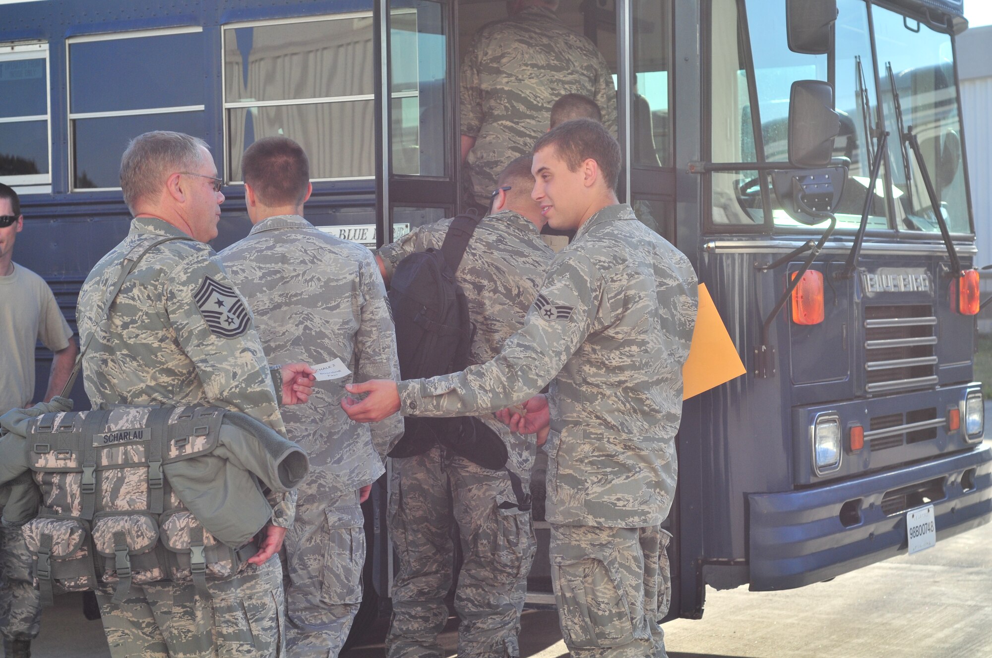 914th Airlift Wing Command Chief Master Sgt. Scott Scharlau boards a bus on the flightline prior to departing the Niagara Falls Air Reserve Station to a stateside training combat outpost for ORI exercises July 22, 2011. Niagara leadership and integral Airmen attend these pre-ORI exercises in order to learn and share what their Wing will face during the upcoming inspection. (U.S. Air Force Photo by Staff Sgt. Joe McKee)