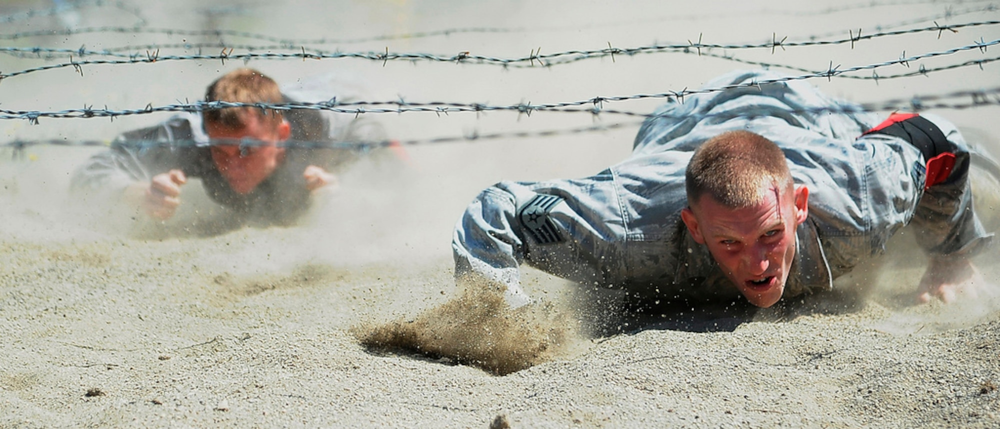 Staff Sgt. Stephen Barber and Senior Airman Tim Dent, 621st Contingency Response Wing security forces, charge through the combat endurance at the Air Mobility Rodeo 2011, July 28, Joint Base Lewis-McChord, Wash. (U.S. Air Force photo by 1st Lt. Brooke Brzozowske/Released)