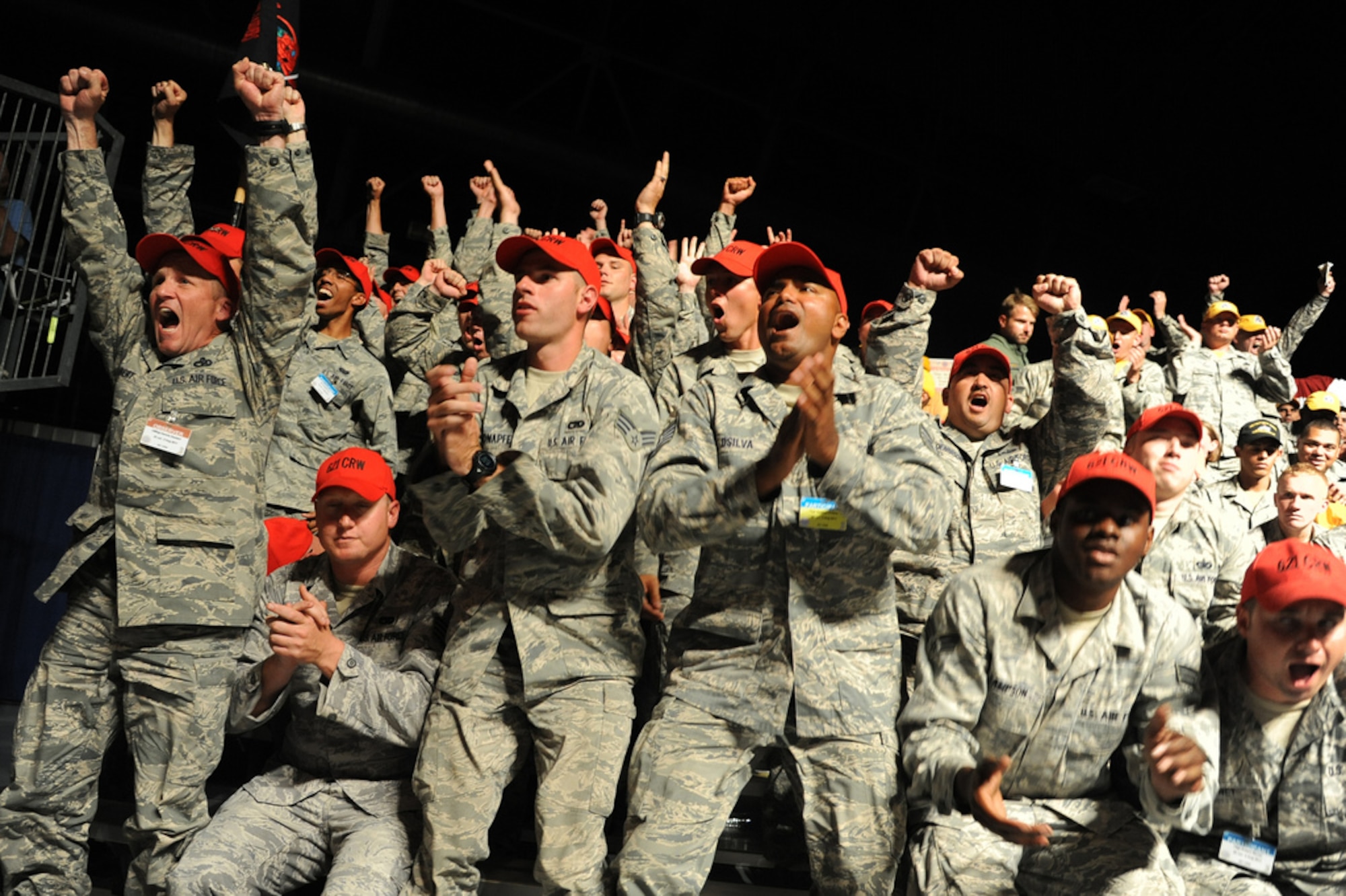 Members of the 621st Contingency Response Wing rise from their seats to cheer at the announcement of winning Air Mobility Rodeo 2011's Best Contingency Response Operations Team, July 29, at Joint Base Lewis-McChord, Wash. The wing returned with trophies for Air Mobility Command’s Best Joint Inspection, Best Advanced Designated Marksmen Team, Best Contingency Response SPICE, Best Contingency HELAMS and the wing’s crowning achievement, AMC’s Best Contingency Response Operations Team. (U.S. Air Force photo by 1st Lt. Brooke Brzozowske/Released)