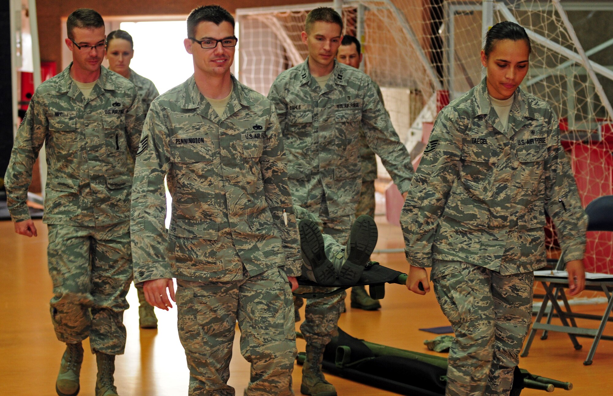 SPANGDAHLEM AIR BASE, Germany – Saber Airmen carry a stretcher during self aid and buddy care hands-on training here July 28. The training took place to ensure service members are prepared for potential deployments, local disasters, humanitarian missions and homeland attacks. (U.S. Air Force photo/Airman 1st Class Matthew B. Fredericks)