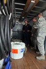 KUNSAN AIR BASE, Republic of Korea -- Airmen from the 8th Maintenance Squadron crash and recovery, give Col. Scott Pleus, 8th Fighter Wing commander, a tour of their crash and recovery truck here August 2.  (U.S. Air Force photo/Senior Airman Brittany Y. Bateman)