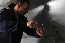 KUNSAN AIR BASE, Republic of Korea -- Col. Scott Pleus, 8th Fighter Wing commander, works beside Airmen in the phase inspection section of the Maintenance Squadron here August 2. Col. Pleus visited each section of the Maintenance Group as part as his Immersion tour of the base. (U.S. Air Force photo/Senior Airman Brittany Y. Bateman)