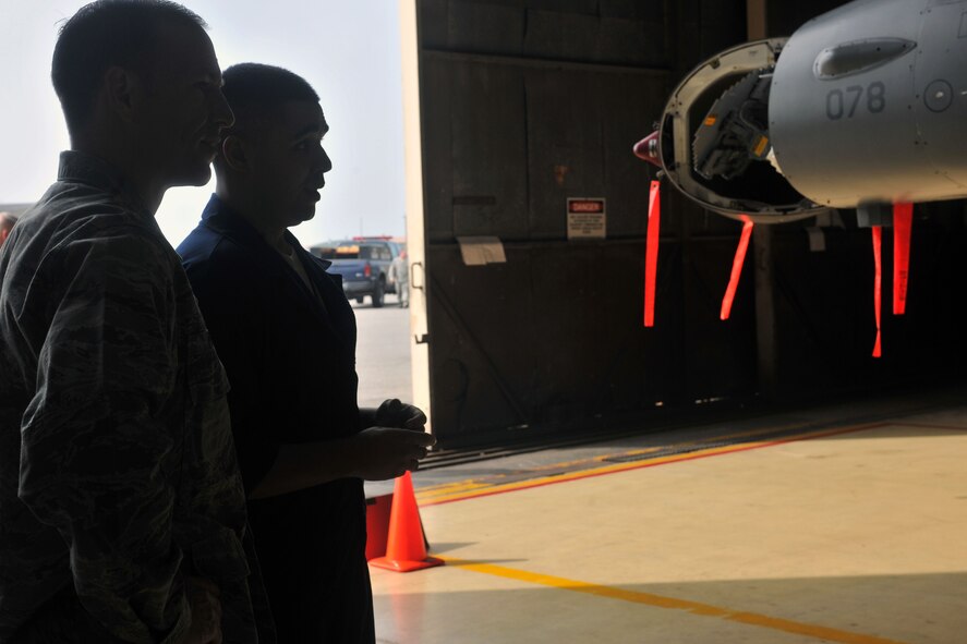 KUNSAN AIR BASE, Republic of Korea -- Staff Sgt. Jon Paul Aubert, 8th Maintenance Squadron phase inspection technician, describes what he does on a daily basis to Col. Scott Pleus, 8th Fighter Wing commander, here August 2. Col. Pleus visited each section of the Maintenance Group as part as his Immersion tour of the base. (U.S. Air Force photo/Senior Airman Brittany Y. Bateman