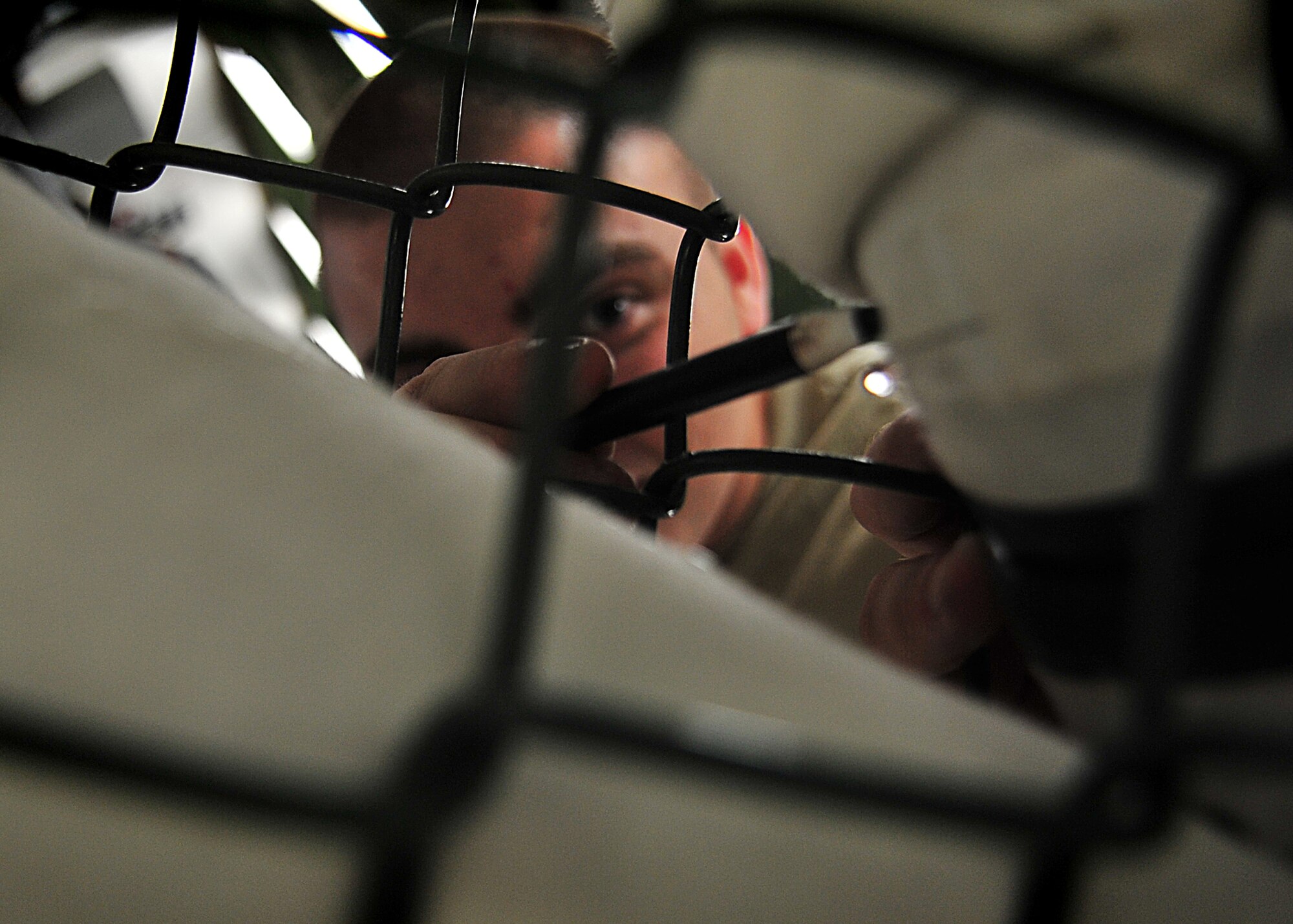 An Air Crew Flight Equipment Journeyman, Senior Airman Anthony Sportsman from the 51st Operation Support Squadron inspected an anti-exposure suit using the water tester.  Airman Sportsman sealed the feet, arms and neck openings of the anti exposure suit.  Once sealed, he filled the suit with water.  After the suit was completely filled with water, he looked for beads of water to form [an indication of a small hole or tear].  In the event that a small hole or tear is found Airman Sportsman circles the area with a black grease pencil.  When all the holes are found and circled, Airman Sportsman then empties the suit, turns it inside-out and sets it to dry for the necessary repairs to be made.  The anti-exposure suit is a vital operational item and mandatory for pilots that fly over waters that have a temperature of 50 degrees or below.(U.S. Air Force Photo by/Staff Sgt. Daylena Gonzalez)