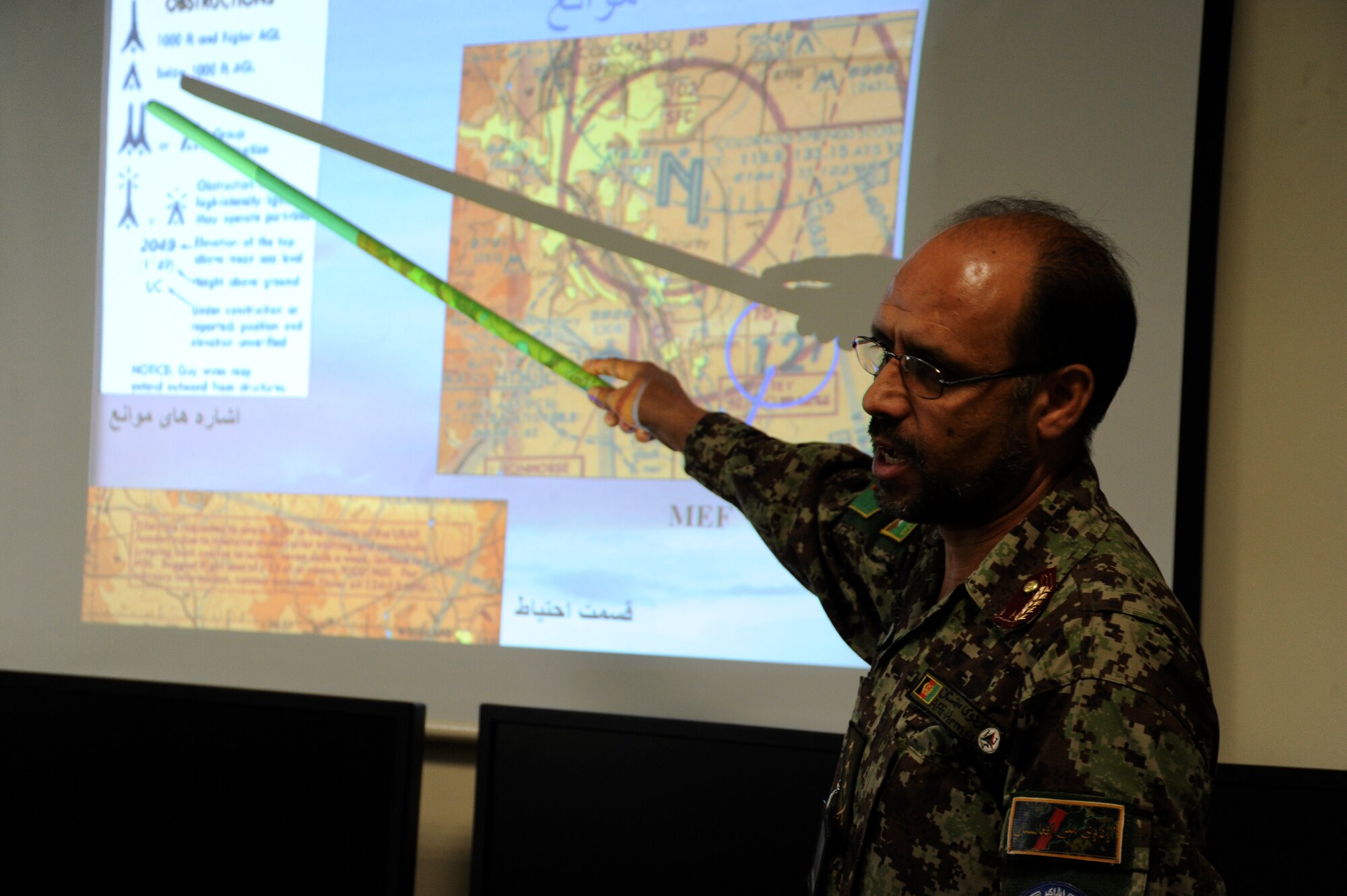 Afghan Air Force Col. Faizuden teaches the Pre-Undergraduate Flight Indoctrination course at Pohantoon-e-Hawayee, the AAF’s “Air University,” August 2, 2011. Faizuden was in the final stages of becoming PeH’s first fully-qualified PeH instructor. PeH is located on the AAF compound in Kabul and currently has 593 students enrolled from all over Afghanistan in various classes and is the primary in-processing point for all training conducted in the AAF. (U.S. Air Force photo by Staff Sgt. Matthew Smith)