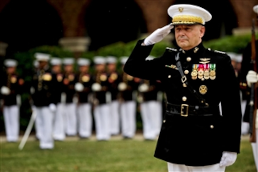 Marine Corps Gen. James E. Cartwright, vice chairman of the Joint Chiefs of Staff, salutes during the playing of the national anthem at a farewell ceremony in his honor at the Marine Barracks in Washington, D.C., Aug. 3, 2011.