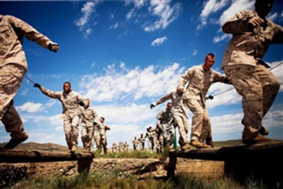 U.S. Marines race through a confidence course during the field training exercise portion of Khaan Quest 2011 at Five Hills Training Area near Ulaanbaatar, Mongolia, Aug. 1, 2011. The annual exercise is co-sponsored by the Mongolian armed forces and U.S. Pacific Command to strengthen the capabilities of the U.S. and Mongolian militaries.