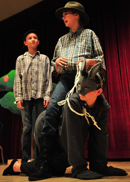 Children from the Osan Children's Theater rehearsed for their performances here, adaptations of two African folktales; 'A Caterpillar's Voice' and 'A Donkey to Market'. The children have been working toward their upcoming performance five days a week for two weeks. Mrs. Kim Adams coordinated the event so that childre, during their summer break have the opportunity to participate in performing arts. In between takes the children played a game called 'typewriter.' This game consisted of one child building a [make believe] story for the rest of the children to act out, which helped sharpen both acting and directing skills.  (U.S. Air Force Photo by/Staff Sgt. Daylena Gonzalez
