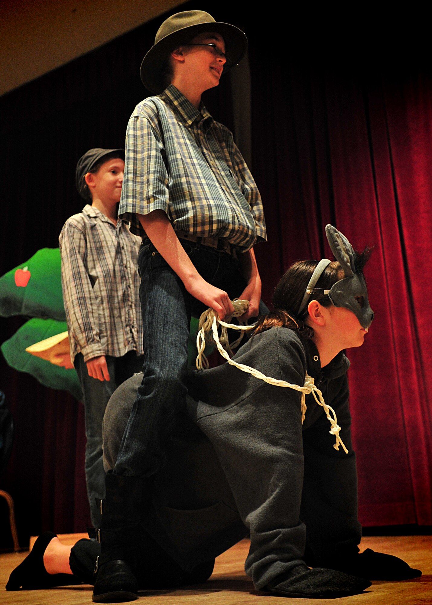 Children from the Osan Children's Theater rehearsed for their performances here, adaptations of two African folktales; 'A Caterpillar's Voice' and 'A Donkey to Market'. The children have been working toward their upcoming performance five days a week for two weeks. Mrs. Kim Adams coordinated the event so that childre, during their summer break have the opportunity to participate in performing arts. In between takes the children played a game called 'typewriter.' This game consisted of one child building a [make believe] story for the rest of the children to act out, which helped sharpen both acting and directing skills.  (U.S. Air Force Photo by/Staff Sgt. Daylena Gonzalez