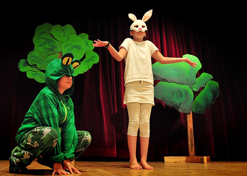 Children from the Osan Children's Theater rehearsed for their performances here, adaptations of two African folktales; 'A Caterpillar's Voice' and 'A Donkey to Market'. The children have been working toward their upcoming performance five days a week for two weeks. Mrs. Kim Adams coordinated the event so that childre, during their summer break have the opportunity to participate in performing arts. In between takes the children played a game called 'typewriter.' This game consisted of one child building a [make believe] story for the rest of the children to act out, which helped sharpen both acting and directing skills.  (U.S. Air Force Photo by/Staff Sgt. Daylena Gonzalez