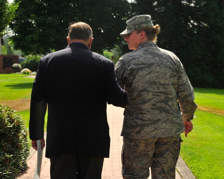 Master Sgt. Brenda Degnan (right), 62nd Maintenance Squadron, walks with retired Col. Joe Jackson, Medal of Honor recipient, toward the Prisoner of War/Missing In Action Memorial for her re-enlistment July 29, 2011, at Joint Base-Lewis McChord, Wash. Jackson administered the Oath of Enlistment to Degnan. (U.S. Air Force Photo/Staff Sgt. Frances Kriss)