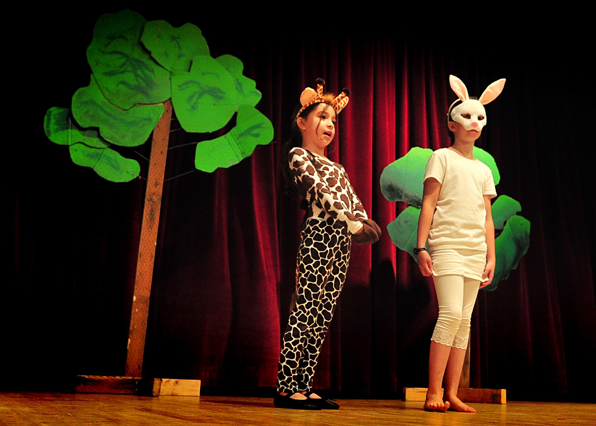 Children from the Osan Children's Theater rehearsed for their performances here, adaptations of two African folktales; 'A Caterpillar's Voice' and 'A Donkey to Market'. The children have been working toward their upcoming performance five days a week for two weeks. Mrs. Kim Adams coordinated the event so that childre, during their summer break have the opportunity to participate in performing arts. In between takes the children played a game called 'typewriter.' This game consisted of one child building a [make believe] story for the rest of the children to act out, which helped sharpen both acting and directing skills.  (U.S. Air Force Photo by/Staff Sgt. Daylena Gonzalez