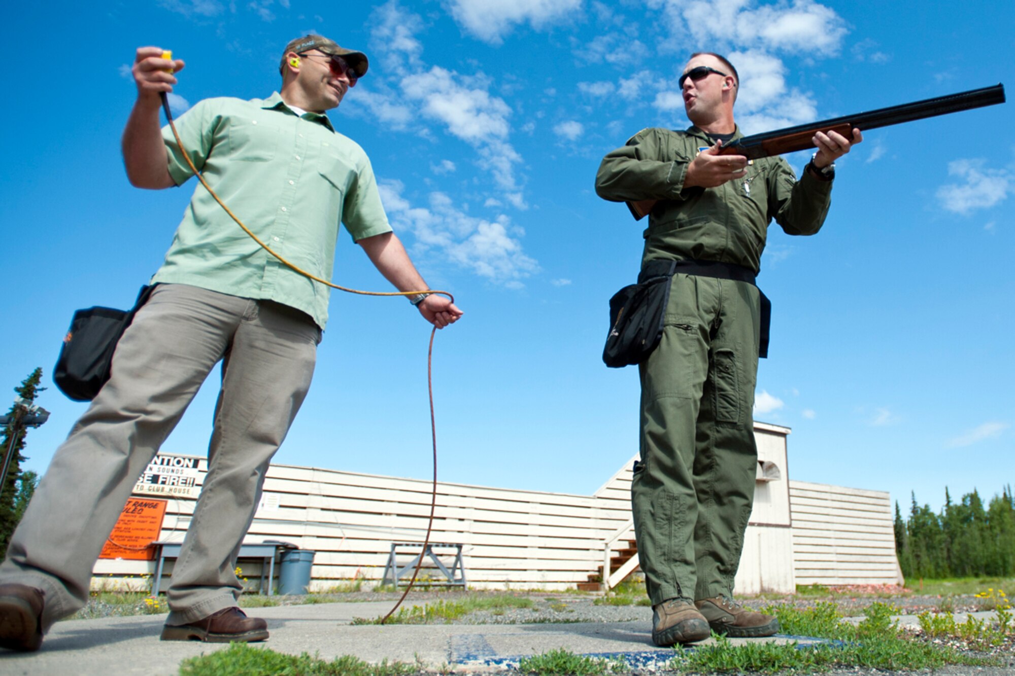 JOINT BASE ELMENDORF-RICHARDSON, Alaska -- U.S. Army Master Sgt. Matt Palmer, 3rd Mobilization Support Group, left, and Tech Sgt. Reid Beveridge, 3rd Operations Support Squadron, pose for a photo at the Joint Base Elmendorf-Richardson Skeet and Trap Range, Thursday, July 28, 2011.  The pair were awarded the 2011 Alaska Skeet Shooting Association's Skeeter Award. (U.S. Air Force/Justin Connaher)