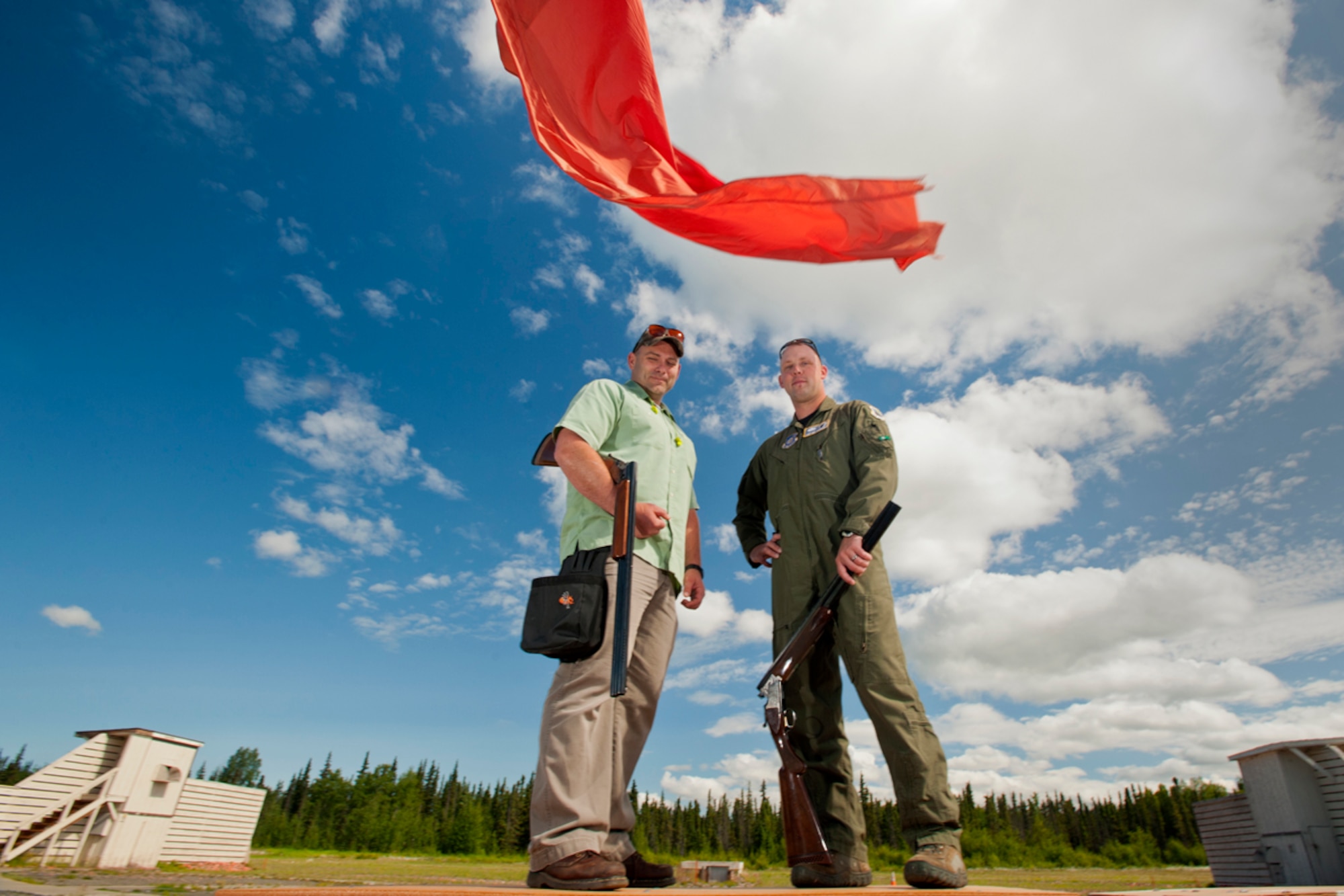 JOINT BASE ELMENDORF-RICHARDSON, Alaska -- U.S. Army Master Sgt. Matt Palmer, 3rd Mobilization Support Group, left, and Tech Sgt. Reid Beveridge, 3rd Operations Support Squadron, pose for a photo at the Joint Base Elmendorf-Richardson Skeet and Trap Range, Thursday, July 28, 2011.  The pair were awarded the 2011 Alaska Skeet Shooting Association's Skeeter Award. (U.S. Air Force/Justin Connaher)