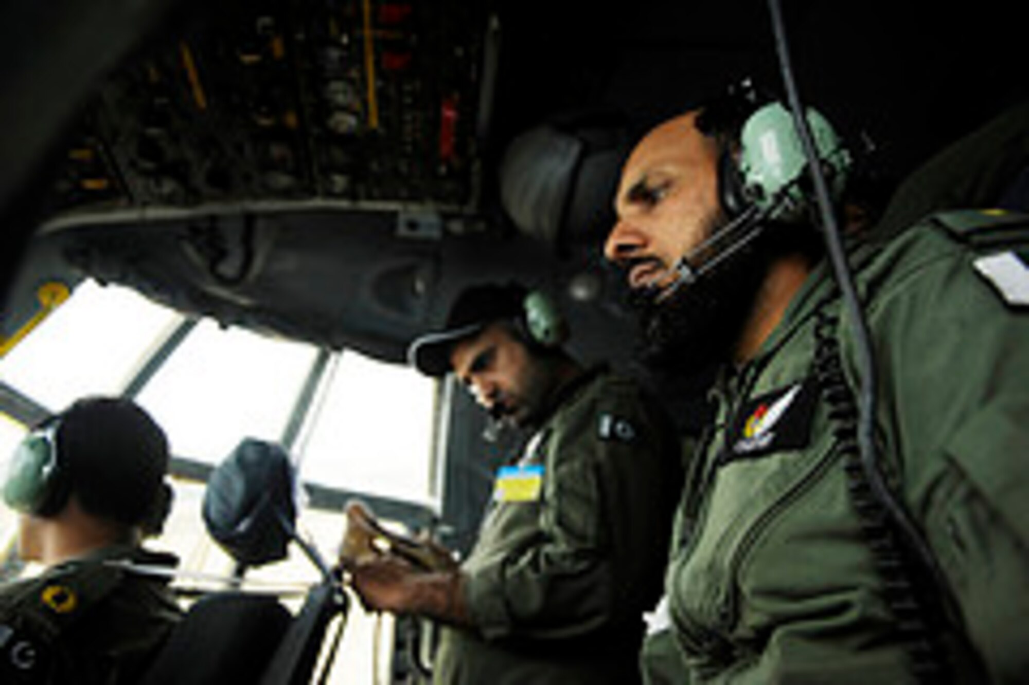 Members of the Pakistan air force fly a training mission to prepare for Rodeo 2011 at Joint Base Lewis-McChord, Wash., July 22, 2011.  Air Mobility Rodeo is the U.S. Air Force's and Air Mobility Command’s premier international combat skill and flying operations competition designed to develop and improve techniques, procedures and interoperability, while optimizing international mobility partnerships and enhancing mobility operations..  (U.S. Air Force Photo Staff Sgt. Eric Harris)