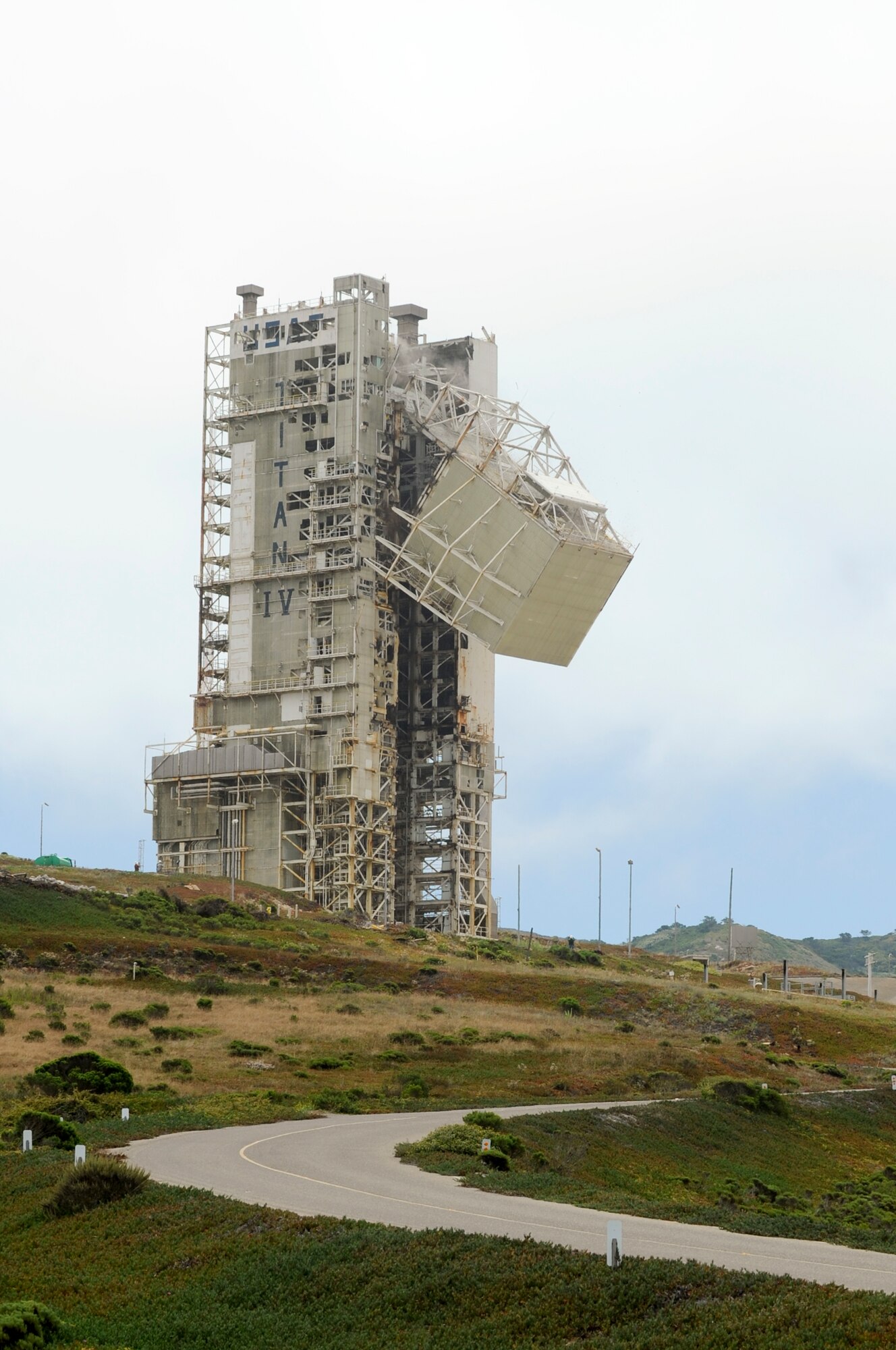 VANDENBERG AIR FACE BASE, Calif. -- Construction crews began tearing down the mobile service tower at Space Launch Complex-4 East in preparation for the Space Exploration Technologies Falcon Heavy mission here, Aug. 2, 2011. The Falcon Heavy, which is touted to be the most powerful vehicle in the world since the Saturn V moon rocket, is expected to have about four million pounds of thrust and the ability to carry payloads weighing more than 53 metric tons. (U.S. Air Force/Staff Sgt. Levi Riendeau)
