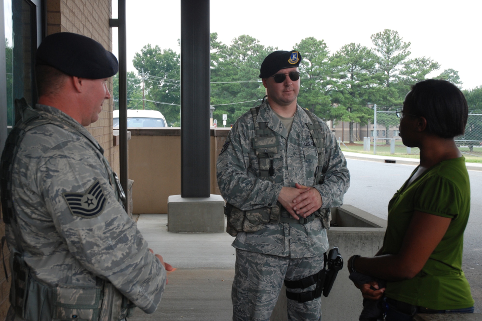 Patrina Sheffield, Dobbins’ contracting specialist and Air Force Reservist speaks with members of the 94th Security Forces Squadron about the newly installed canopy at the Dobbins’ main gate. “Our security forces personnel are very appreciative of the canopy.” said Sheffield, who administered the construction contract for the canopy. “We hope Dobbins enjoys it as well.” (U.S. Air Force photo/Master Sgt. James Branch)