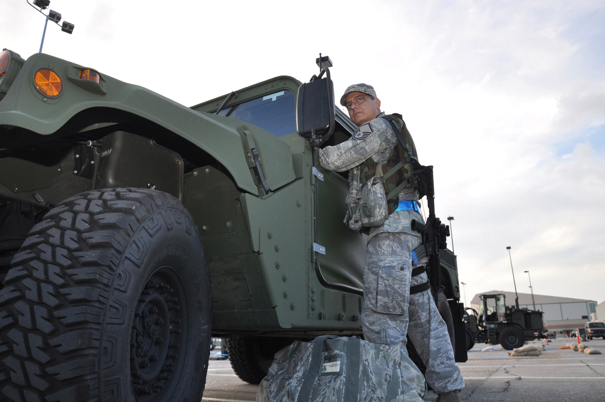 A member of the 315th Security Forces Squadron, 315th Airlift Wing, observes his surroundings as he starts his shift during the Operational Readiness Exercise at Gulfport Training Center, Miss., July 28. Participants from the 315th Airlift Wing, 628th Air Base Wing, 437th Airlift Wing all participated in the event to prepare for their upcoming Operational Readiness Inspection. (U.S. Air Force photo/Tech. Sgt. Scott Mathews)
