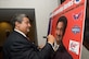 Mr. Ted Leonsis, founder and chairman of Monumental Sports and Entertainment signs his Andrews Leadership Poster after the seventh installment of the Andrews Leaders Series in the Air Force Conference Center here Aug. 3. The monthly guest speaker forum provides a unique venue for nationally recognized leaders to motivate and inspire Joint Base Andrews military and civilian personnel. (Photo by Bobby Jones)