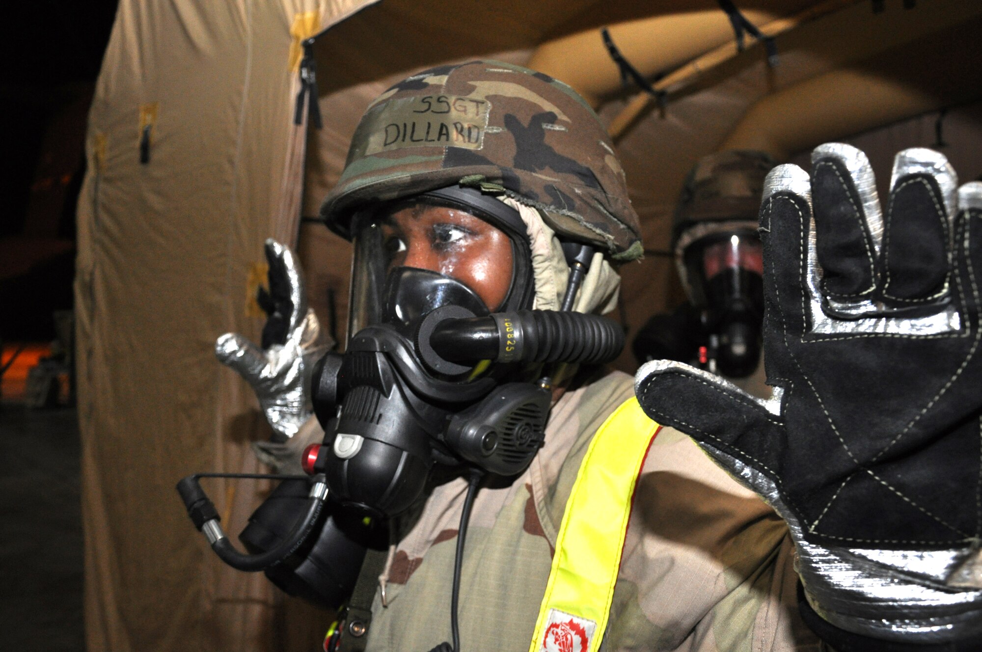 Staff Sgt. Mendi Dillard, 315th Airlift Wing, is processed through the Contamination Control Area to decontaminate herself during an Operational Readiness Exercise at Gulfport Training Center, Miss., July 31. Participants from the 315th Airlift Wing, 628th Air Base Wing, 437th Airlift Wing all participated in the event to prepare for their upcoming Operational Readiness Inspection. (U.S. Air Force photo/Tech. Sgt. Scott Mathews)