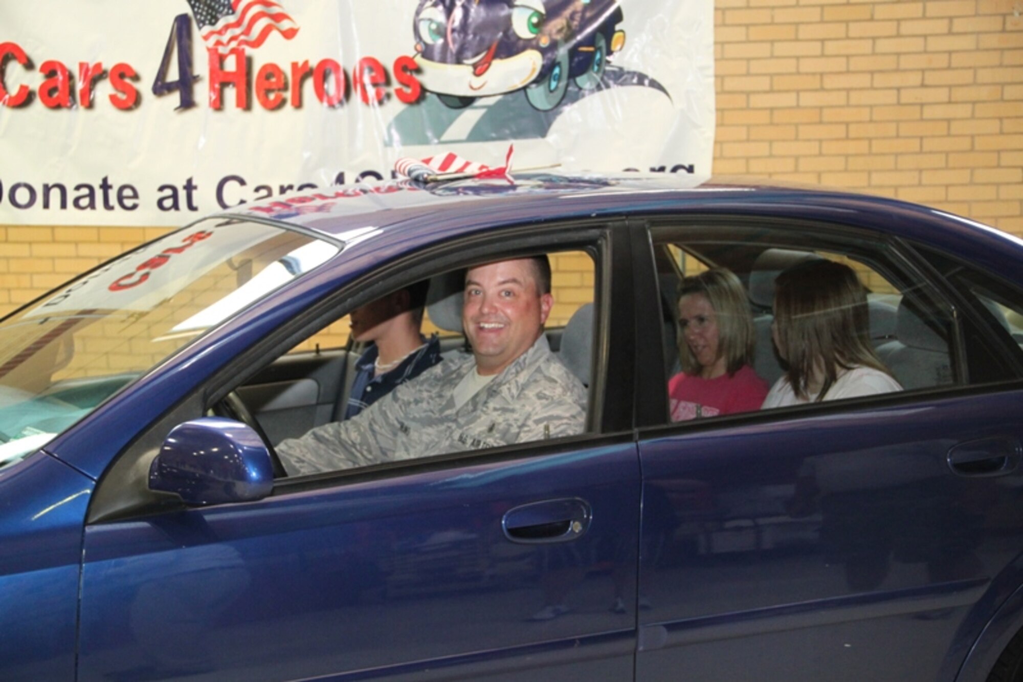 Master Sgt. Jeff Norling along with his family prepare to take their new car for a spin following the ceremony. (Photo by: Capt Joe Blubaugh)