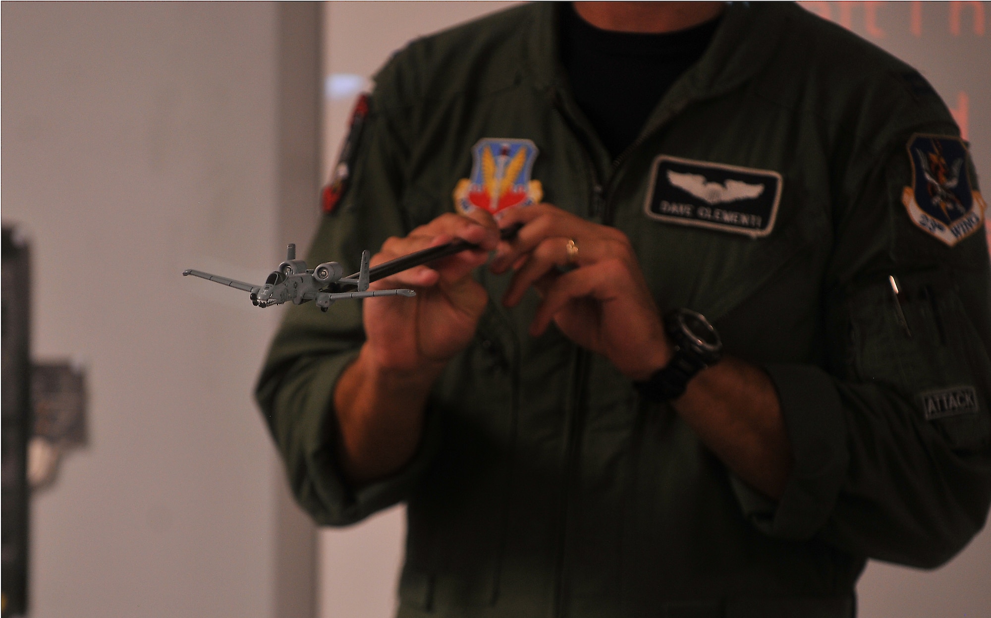 U.S. Air Force Capt. Dave Clementi, 75th Fighter Squadron unit deployment manager, uses a model A-10C Thunderbolt II to describe factors that help planes fly for a group of Boy Scouts during their visit to Moody Air Force Base, Ga., July 31, 2011. Scouts had to describe aircraft and their capabilities in order to earn an aviation merit badge. (U.S. Air Force photo by Airman 1st Class Joshua Green/Released)
