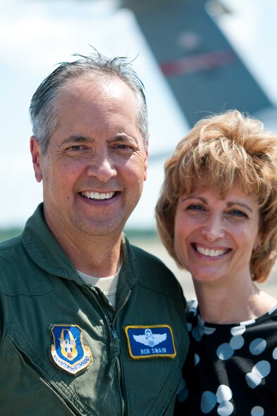 Col. Robert Swain Jr., 439th Airlift Wing commander, flew his final C-5 mission Aug. 3. Dozens of onlookers awaited the conclusion of the commander's fini flight, including his wife, Diane Swain, who used a large hose from the Westover Fire Department to douse her husband shortly after he stepped down the crew ladder from the C-5. The fini flight adds to the colonel's more than 3,500 hours flying C-5s and A-10s -- including 51 combat missions over Southwest Asia. Swain is the first pilot to score an air-to-air kill in an A-10 Thunderbolt II, when he downed an Iraqi helicopter during Operation Desert Storm. He will relinquish command of the 439th AW Aug. 6 to Col. Steven Vautrain. (US Air Force photo/W.C.pope)