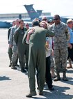 Col. Robert Swain Jr., 439th Airlift Wing commander, flew his final C-5 mission Aug. 3. Dozens of onlookers awaited the conclusion of the commander's fini flight, including his wife, Diane Swain, who used a large hose from the Westover Fire Department to douse her husband shortly after he stepped down the crew ladder from the C-5. The fini flight adds to the colonel's more than 3,500 hours flying C-5s and A-10s -- including 51 combat missions over Southwest Asia. Swain is the first pilot to score an air-to-air kill in an A-10 Thunderbolt II, when he downed an Iraqi helicopter during Operation Desert Storm. He will relinquish command of the 439th AW Aug. 6 to Col. Steven Vautrain. (US Air Force photo/W.C.pope)