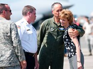 Col. Robert Swain Jr., 439th Airlift Wing commander, flew his final C-5 mission Aug. 3. Dozens of onlookers awaited the conclusion of the commander's fini flight, including his wife, Diane Swain, who used a large hose from the Westover Fire Department to douse her husband shortly after he stepped down the crew ladder from the C-5. The fini flight adds to the colonel's more than 3,500 hours flying C-5s and A-10s -- including 51 combat missions over Southwest Asia. Swain is the first pilot to score an air-to-air kill in an A-10 Thunderbolt II, when he downed an Iraqi helicopter during Operation Desert Storm. He will relinquish command of the 439th AW Aug. 6 to Col. Steven Vautrain. (US Air Force photo/W.C.pope)
