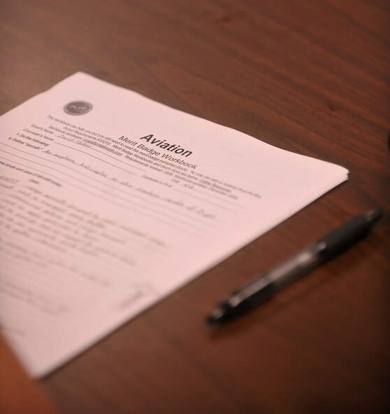An aviation merit badge workbook sits on a desk during a classroom session for Troop 454 Boy Scouts at Moody Air Force Base, Ga., July 31, 2011. Moody Airmen helped the Scouts earn their badges through various hands-on activities. (U.S. Air Force photo by Airman 1st Class Joshua Green/Released)
