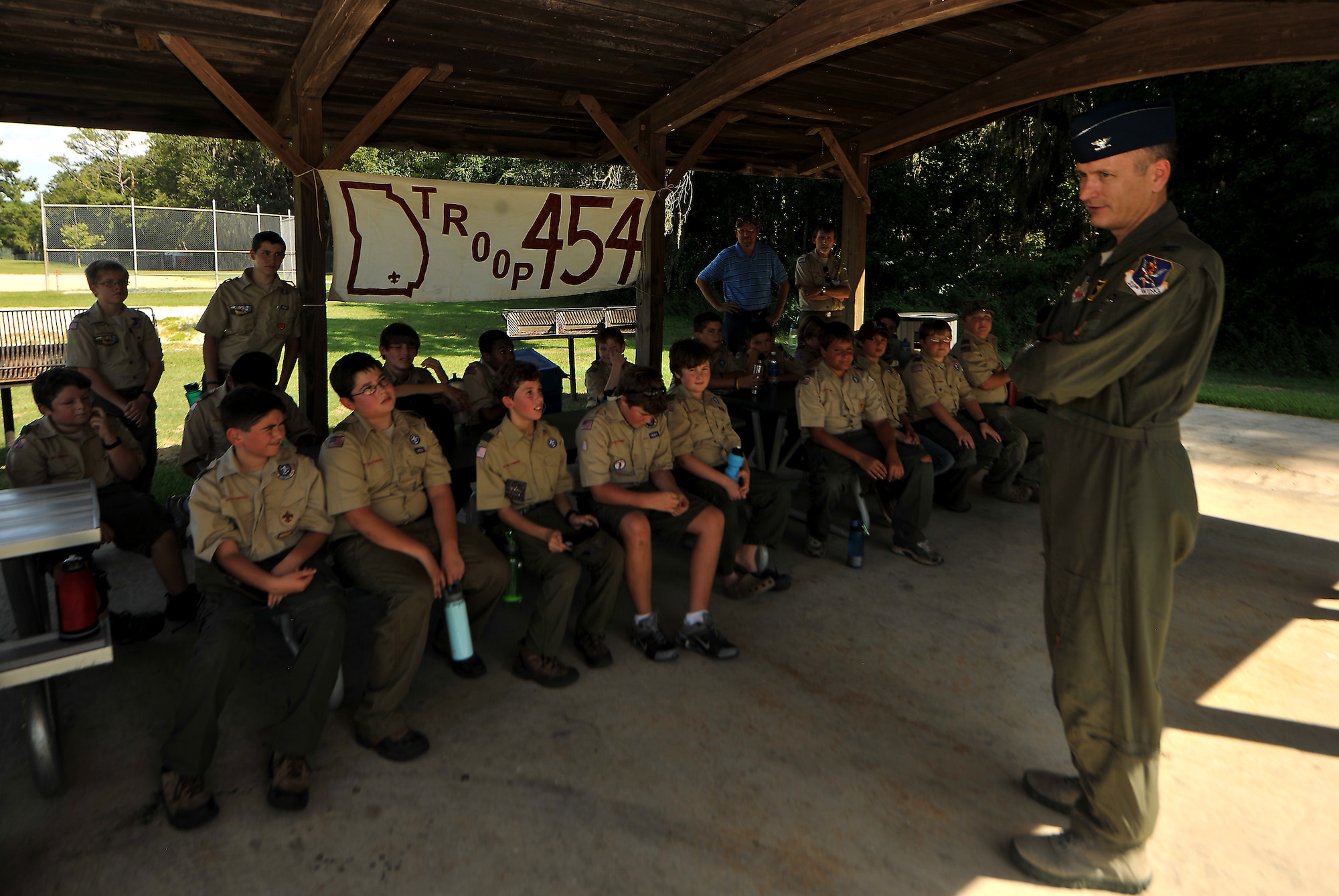 Valdosta Boy Scouts from Troop 454 listen to U.S. Air Force Col. Billy Thompson, 23rd Wing commander talk about being a military pilot at Moody Air Force Base, Ga., July 31, 2011. During their overnight visit, the Scouts earned aviation merit badges, one of the original 57 badges established by the Boy Scouts of America in 1911. (U.S. Air Force photo by Airman 1st Class Joshua Green/Released)

